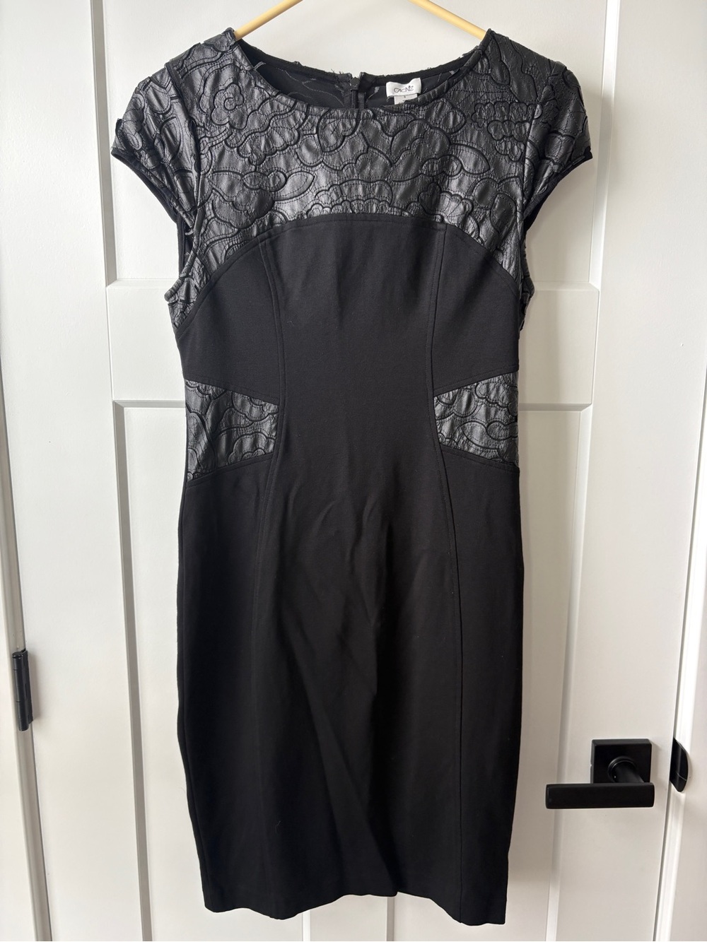 Cache black sheath dress , cap sleeves and floral faux leather accent size 8